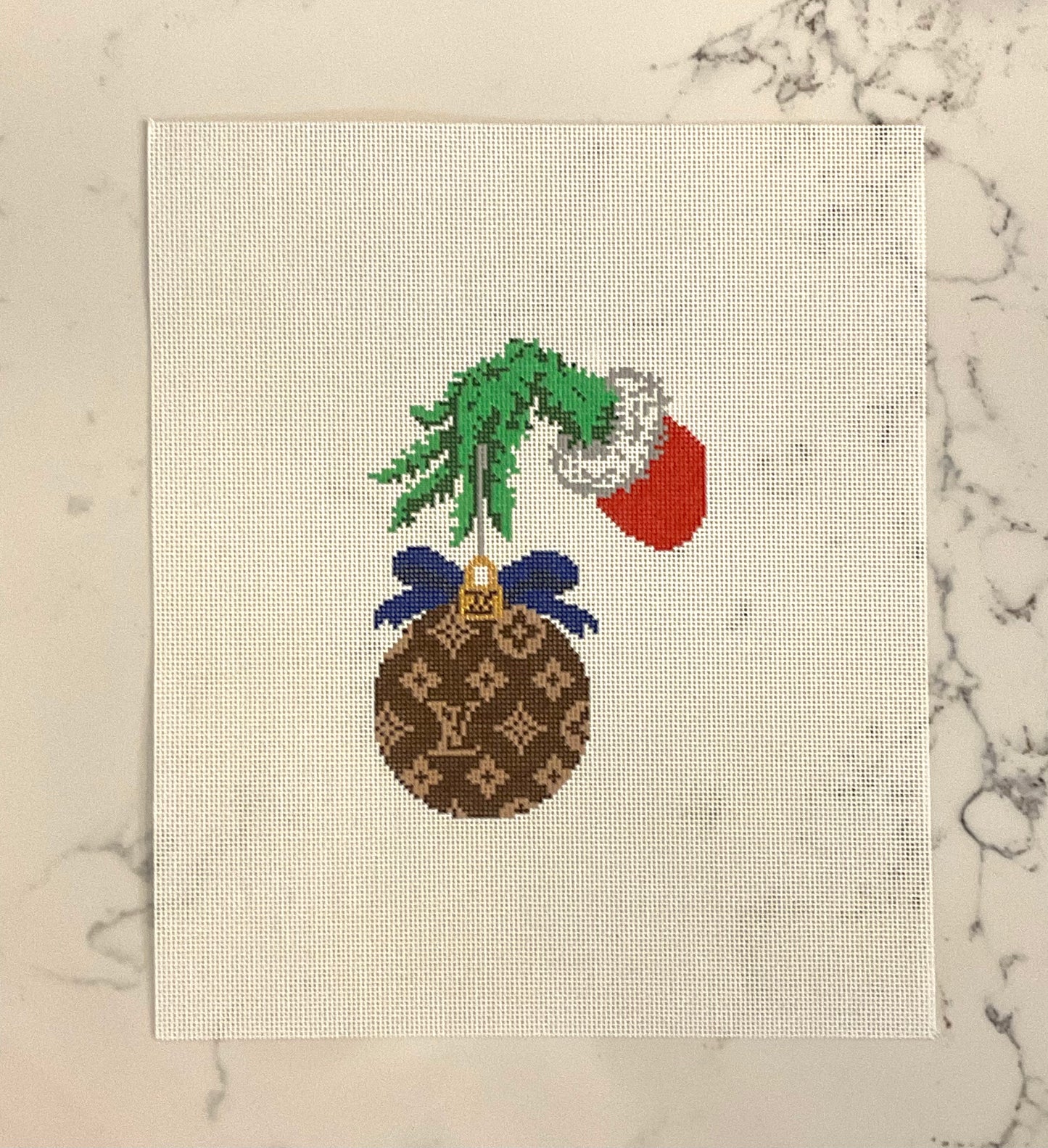 LV ornament with green hand